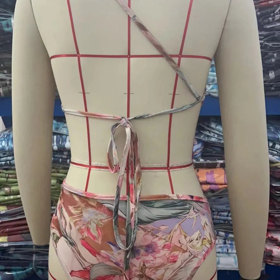 Rose gold patterned women's one-piece swimsuit on a mannequin.