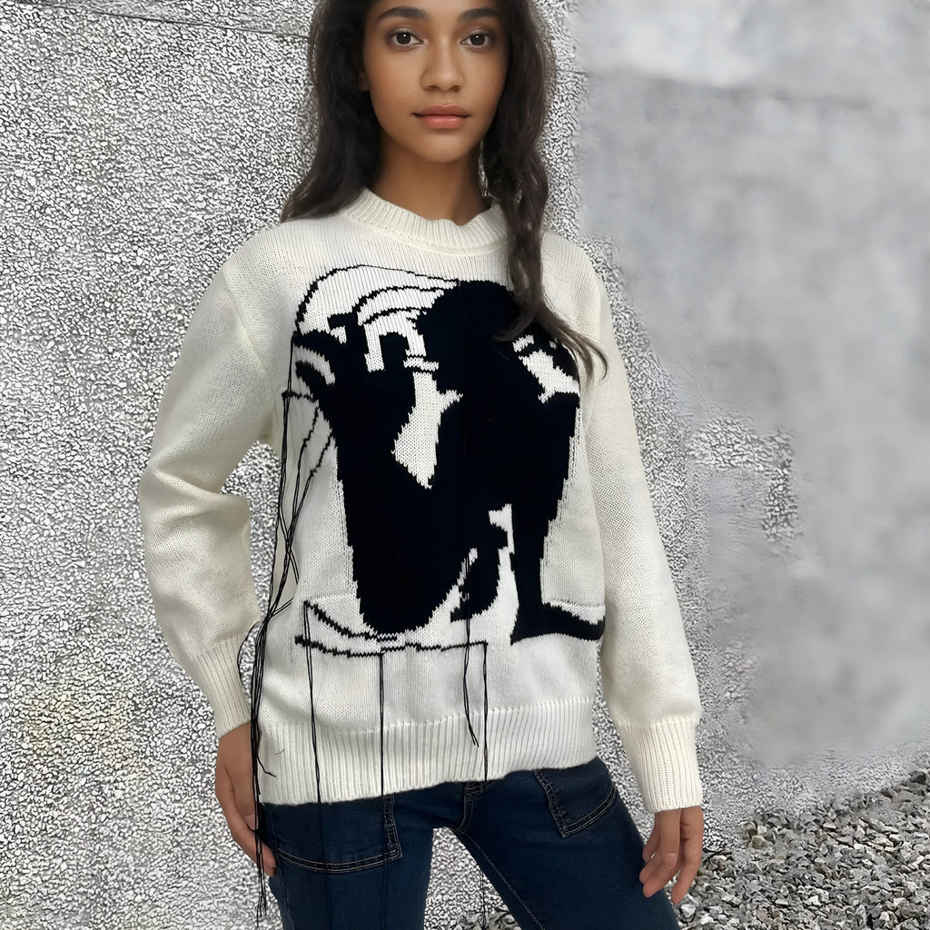 Women's loose grey alpaca wool pullover sweater with tassel detailing and round neck