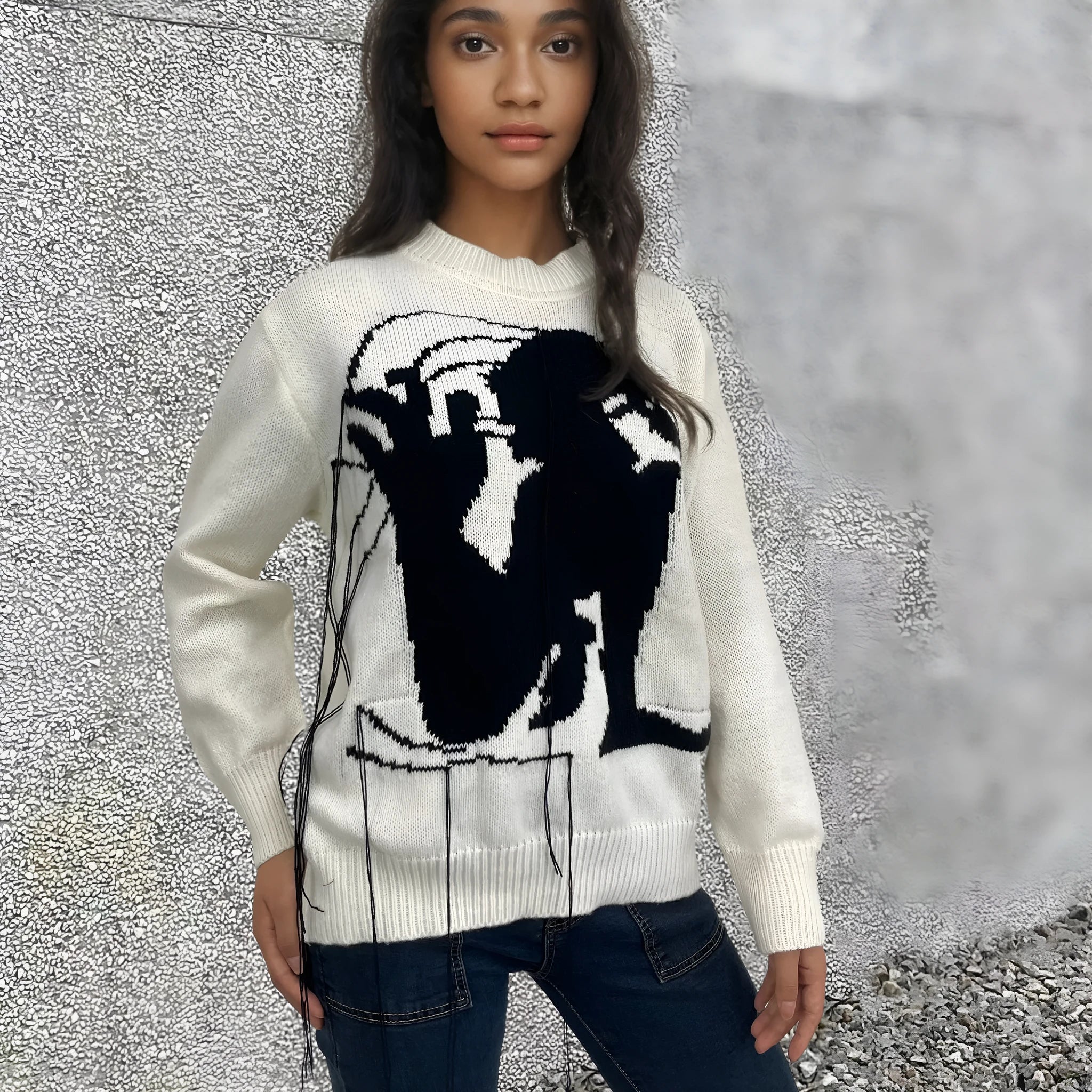 Women's loose grey alpaca wool pullover sweater with tassel detailing and round neck