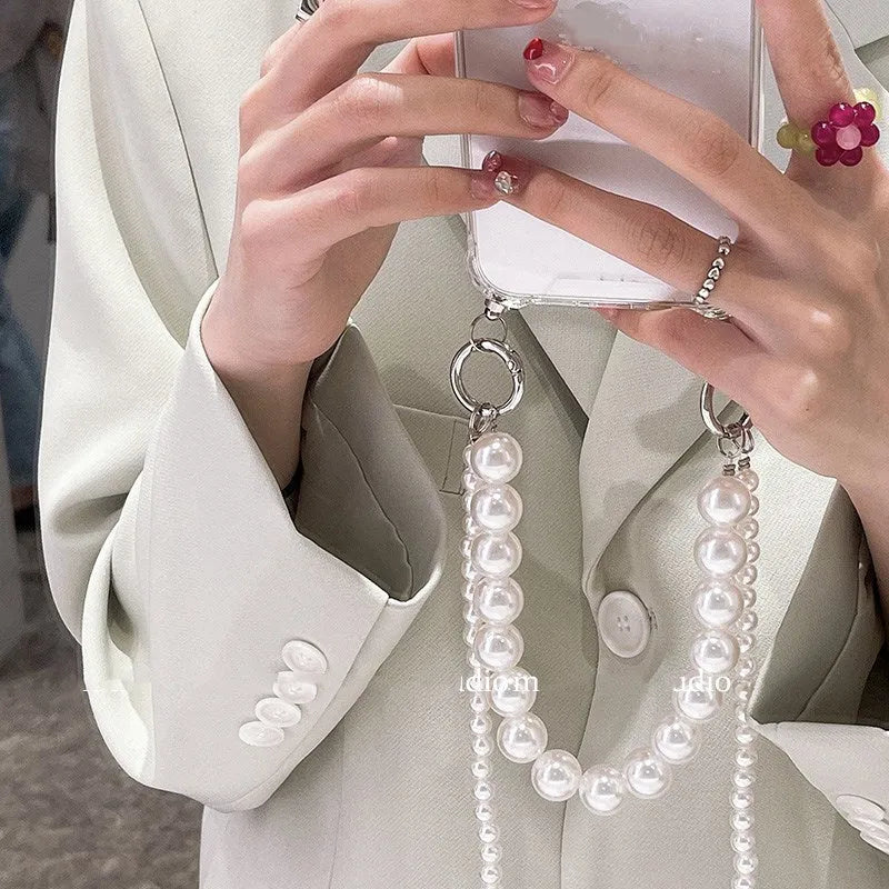 Soft silicone iPhone case with large pearl decoration and attached chain in Japanese Korean style