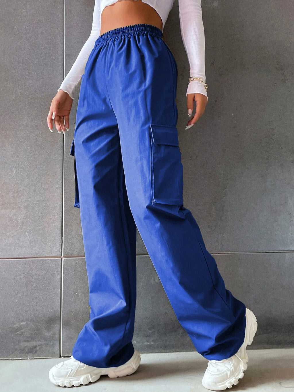 Women's high waist workwear trousers with pockets in solid colours, sizes S to 2XL.