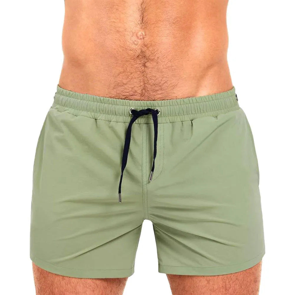 Men's solid colour polyester sports shorts with mesh lining in army green