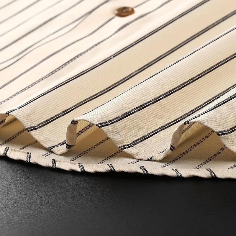Coffee coloured striped men's long-sleeved business shirt with slim fit on a plus-size model
