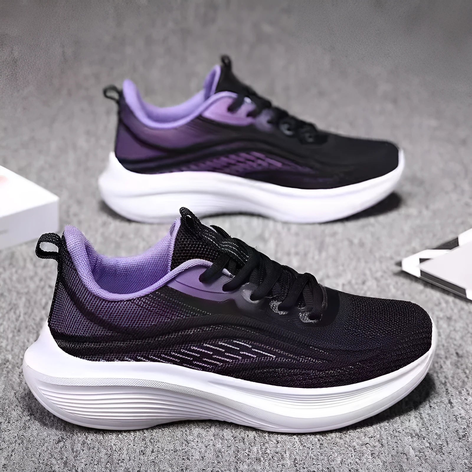 Women's lightweight running shoes with breathable mesh upper, flat heel, and front lace-up closure