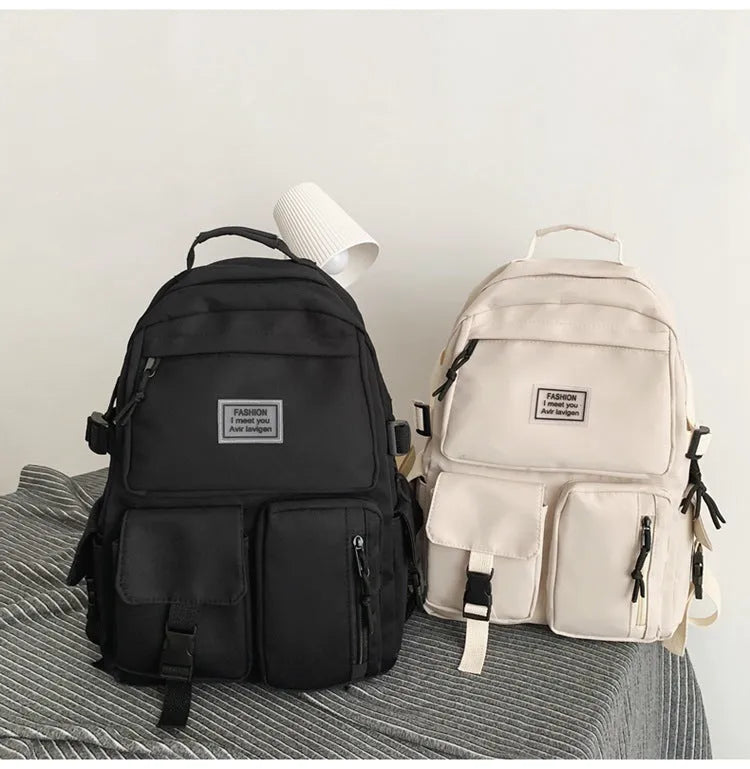 Black and white soft nylon student backpack with laptop compartment and three-dimensional pockets