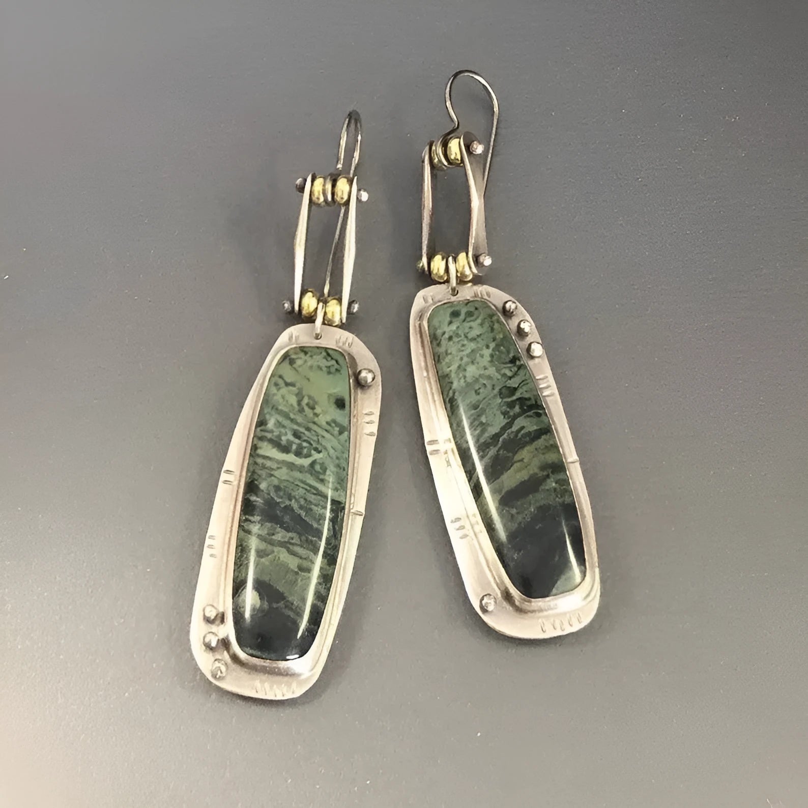 Geometric drop earrings with a two-tone marble pattern finish, made from silver-toned alloy.