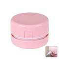 Portable mini desktop vacuum cleaner in blue and pink colour options with rechargeable battery