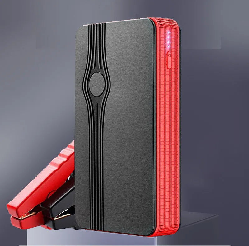 Red K4-E automobile emergency jump starter power supply with data cable.