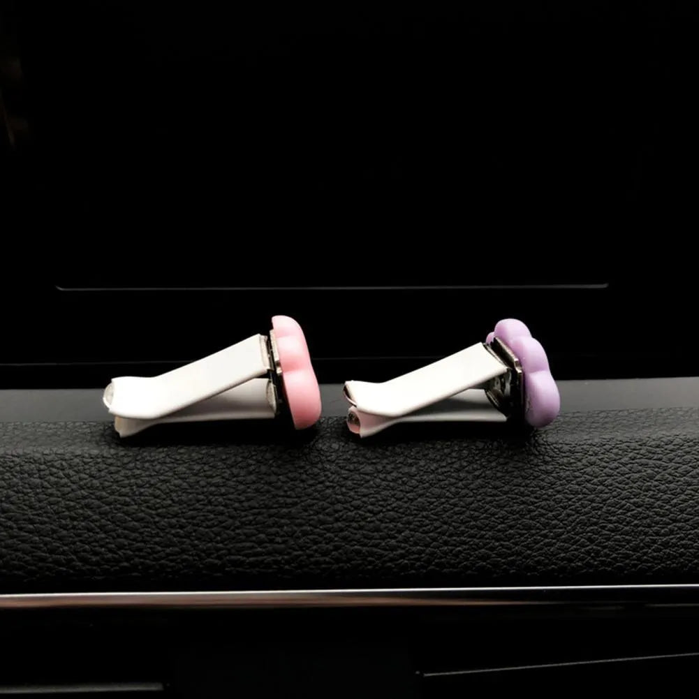 Baiyun cartoon resin car air vent fragrance clip in six colour options on a vent.