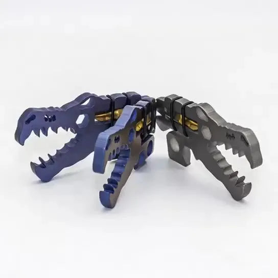 Dinosaur head tool in TC4 titanium, 78 x 42 x 5mm, 34g, shown in grey blue or copper for outdoor and home use
