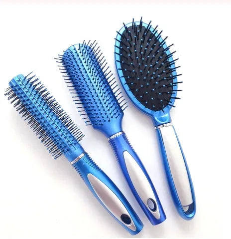 Pink electric ionic hair comb with ergonomic design on white background