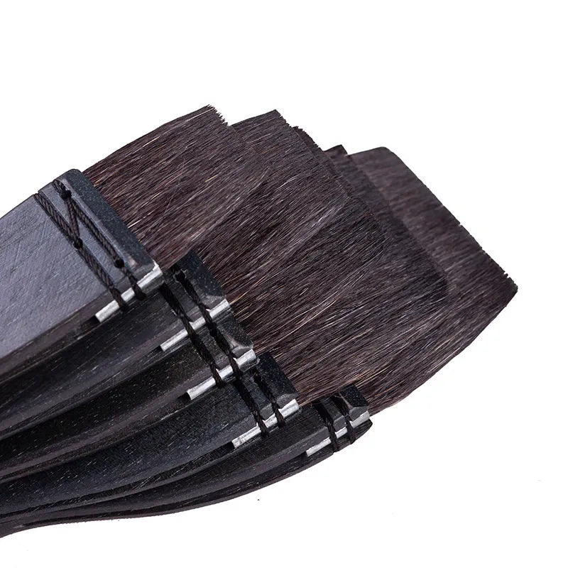 Grey squirrel hair makeup brush with wooden handle showing soft natural bristles