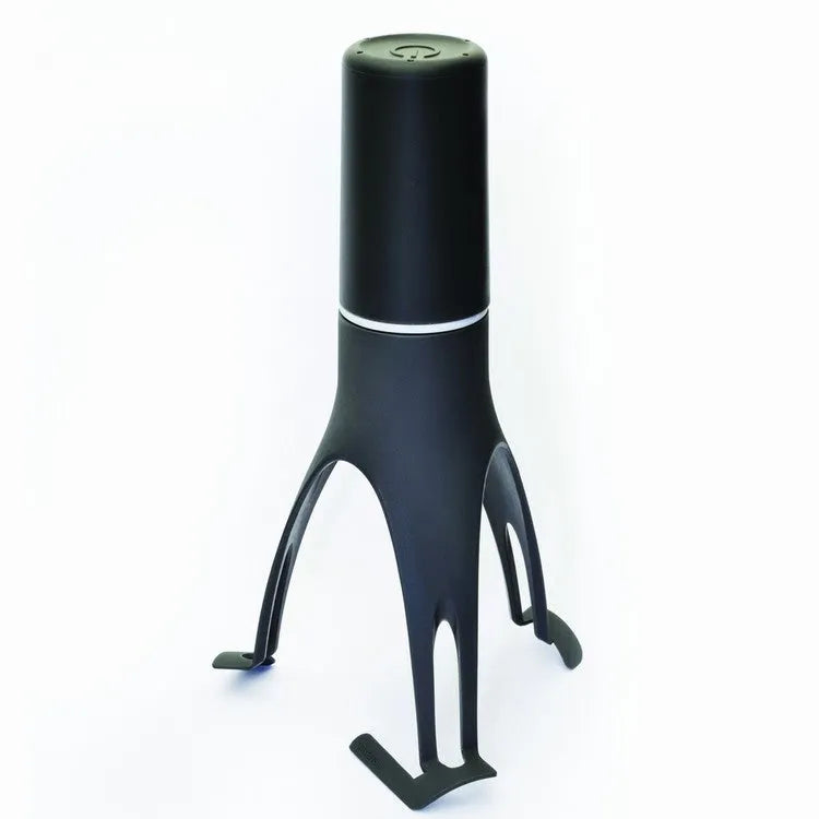Green or grey Uutensil Stirr automatic pot mixer device for hands-free stirring of sauces and soups.