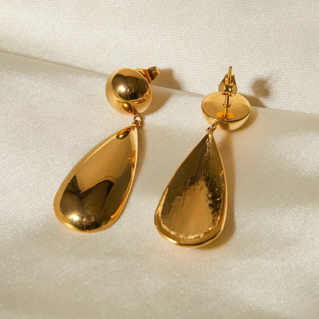 Gold coloured stainless steel earrings with a geometric shape and water drop pendant.