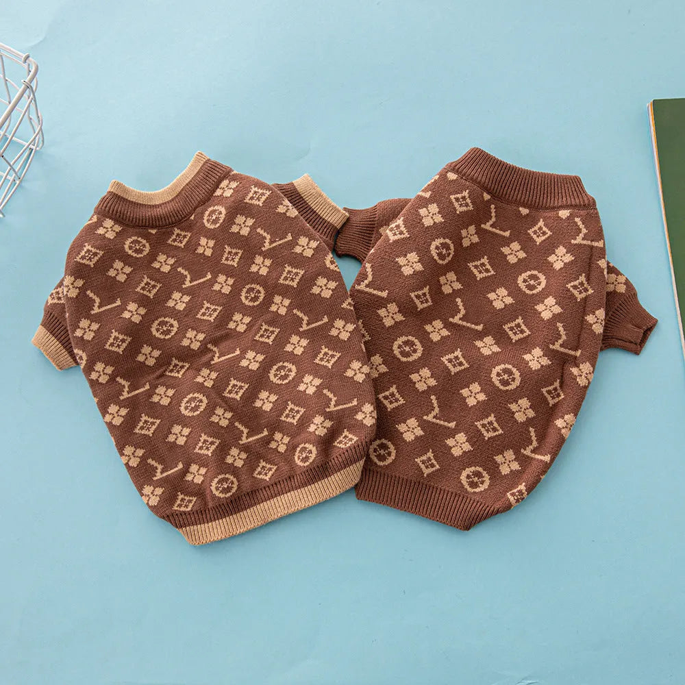 A thick knitted wool dog sweater shown in a two-tone colour, sized for a small breed.