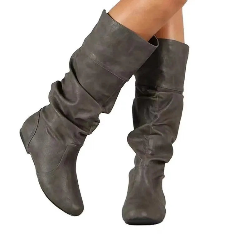 Women's black flat heel slip-on long boots with round toe and high cylinder shaft.