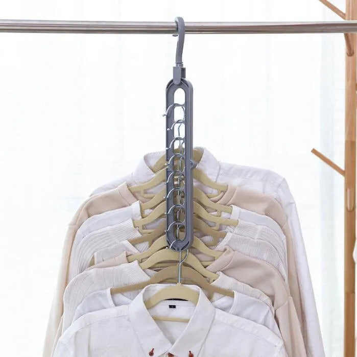 Plastic clothes hanger with a white hook on a pink background, showing its 33 cm length and rotatable handle.