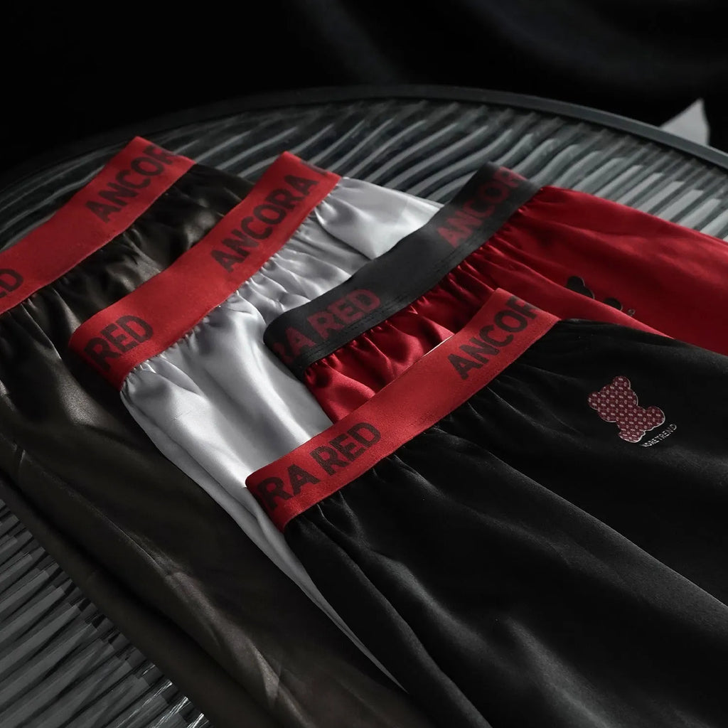 A pair of solid colour men's boxer briefs on a mid-waist fit model, shown in one of the six available colours.
