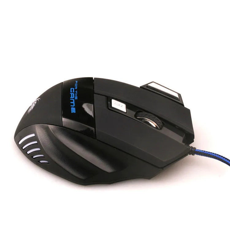 Black wired USB gaming mouse with colourful LED lights and Tyrannosaurus Rex graphic on a desk