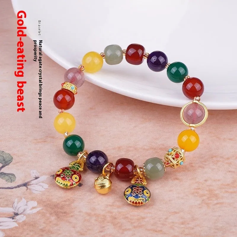 Hand-woven swallowing gold beast charm on 10mm agate bead bracelet