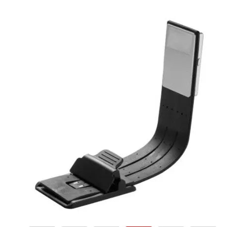 Black plastic folding LED reading lamp shown open and closed, highlighting its thin 9mm profile.