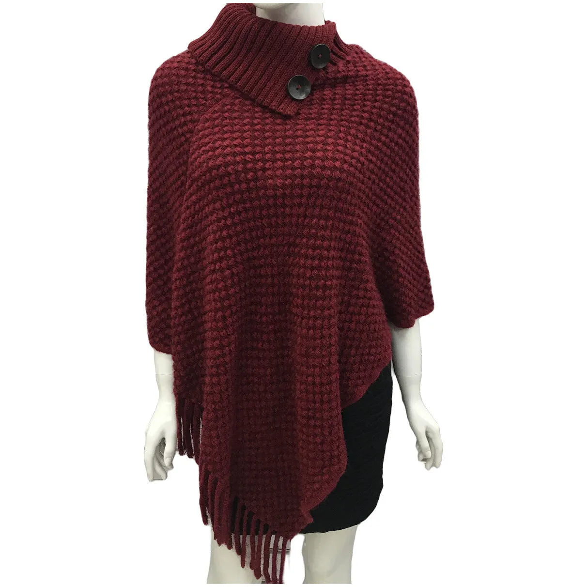 Sleeveless dotted-pattern cloak shawl in acrylic knitwear, shown in apricot colour.