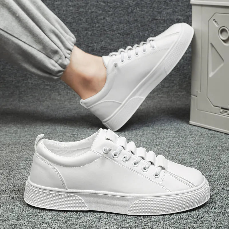Men's black and white low top sports shoes with synthetic leather upper, mesh panels, and a flat PVC sole.
