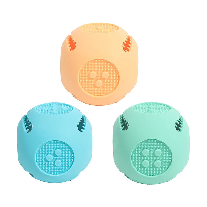 Silicone dice-shaped dog toy in yellow, sky blue, or green for treat dispensing and slow feeding.