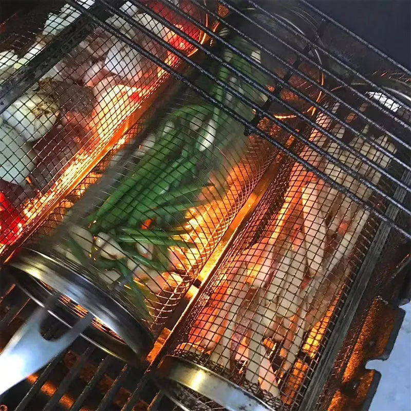 Stainless steel cylindrical rolling barbecue basket with wire mesh for grilling vegetables and meat.