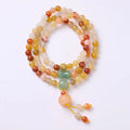 Women's Jinsi Jade bracelet with three-circle pumpkin design and tassels on a wrist