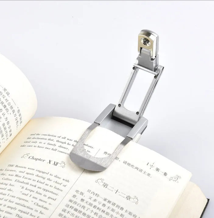 Folding book light in plastic and stainless steel, compact 12cm clip-on reading light for books and e-readers