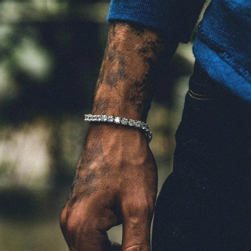 Men's silver hip hop bracelet with single row chain links and rhinestone details on wrist