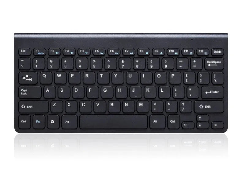 Black and white wireless keyboard and mouse set on a desk.