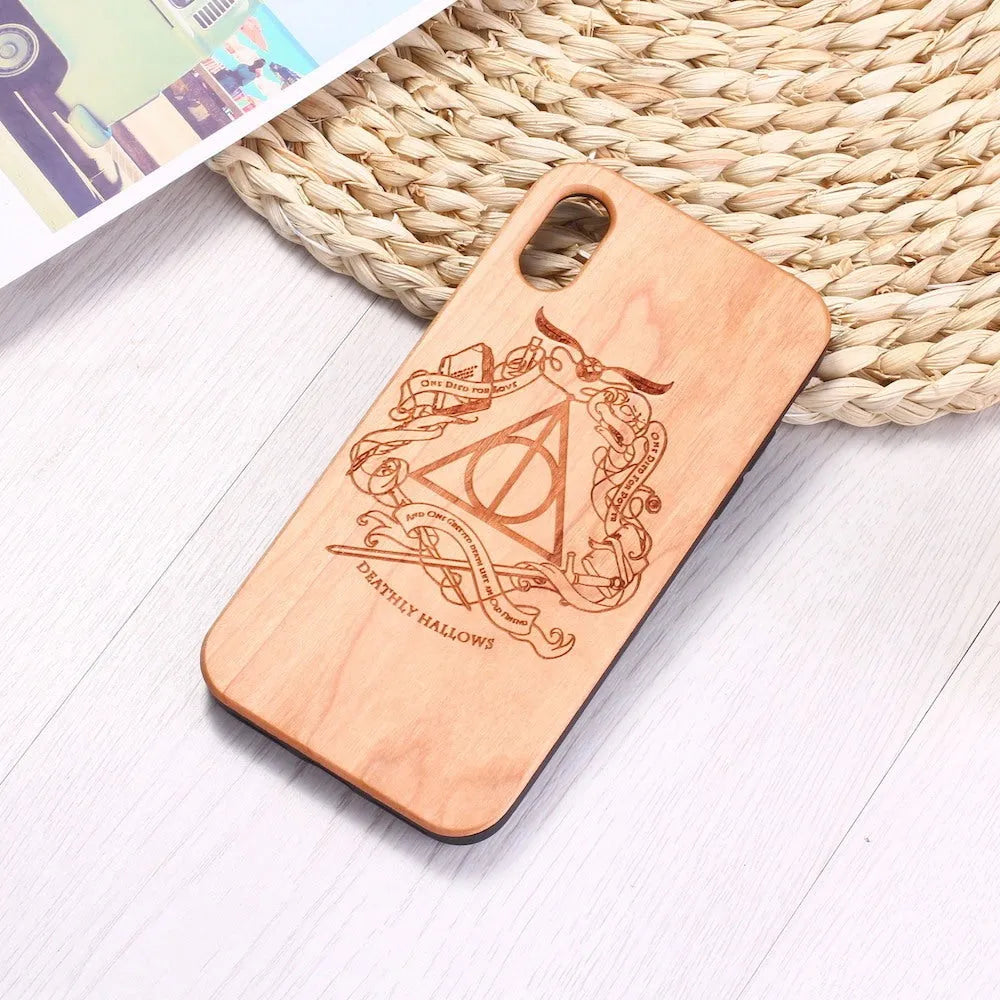 Wooden phone case with TPU bumper showing laser-carved pattern on wooden back