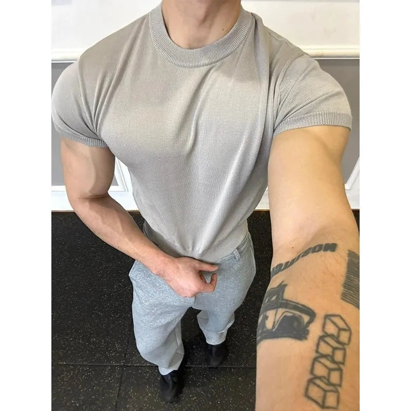 Men's slim fit short sleeve polyester T-shirt showing cuff-closing thread detail in solid colour option.