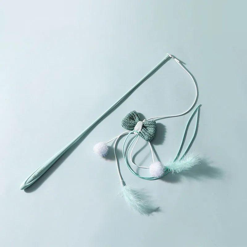Blue cat toy wand with long pole and a bite-resistant rocket attachment decorated with feathers.