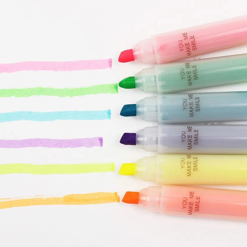 Set of six highlighter pens in different colours showing oblique tip design.