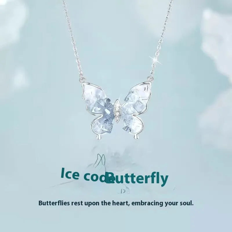 Close-up of a silver Bingyu Butterfly necklace with an ice rain pendant on an adjustable O-ring chain.