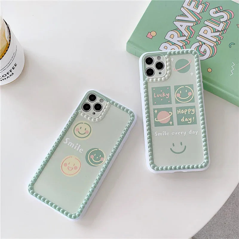 Green soft rubber TPU iPhone case with geometric pattern and smiley face polka dot frame design.