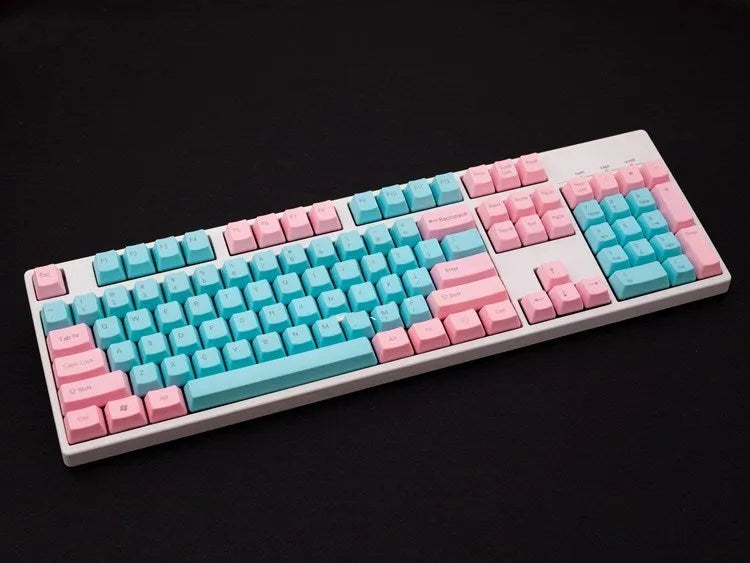 Pink opaque PBT keycap set for mechanical keyboards showing side-engraved legends on 1.5mm thick keys