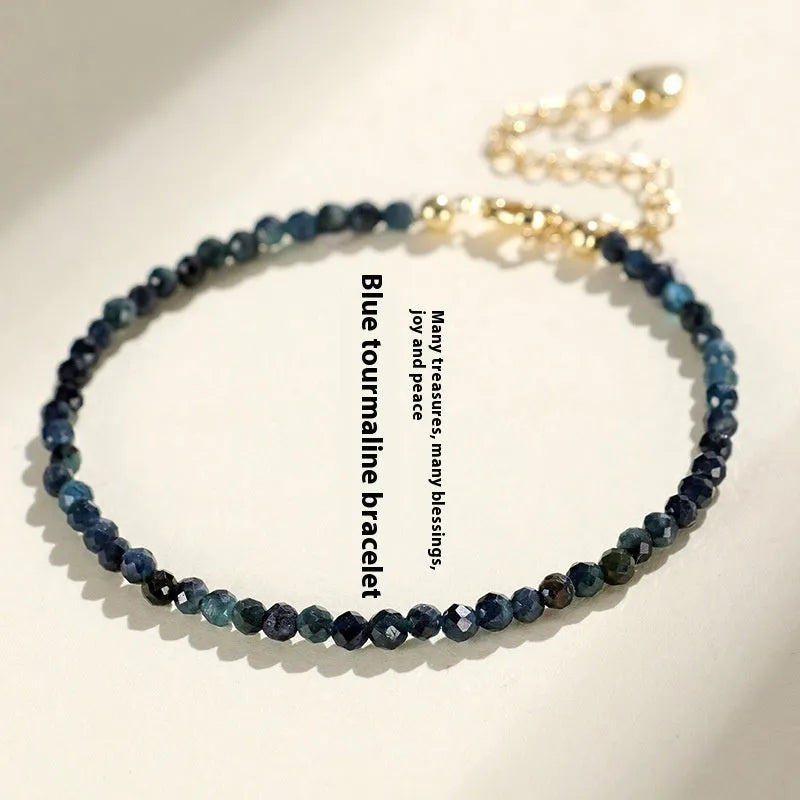 Blue tourmaline cut bead bracelet with 3mm faceted stones and spacer beads