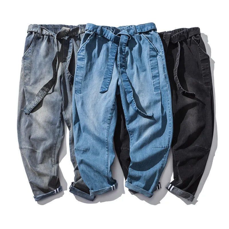 Punk stretch bike denim jeans in solid colour with elastic waist and patches