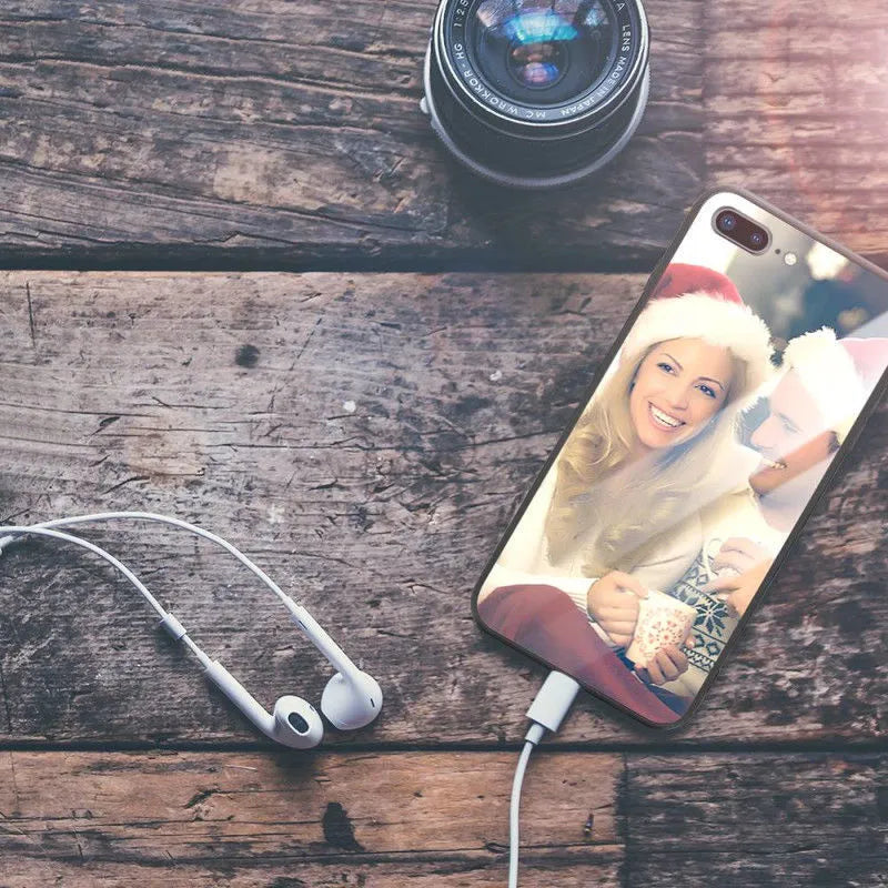 Patterned hard iPhone case with raised edge around camera lens on a table