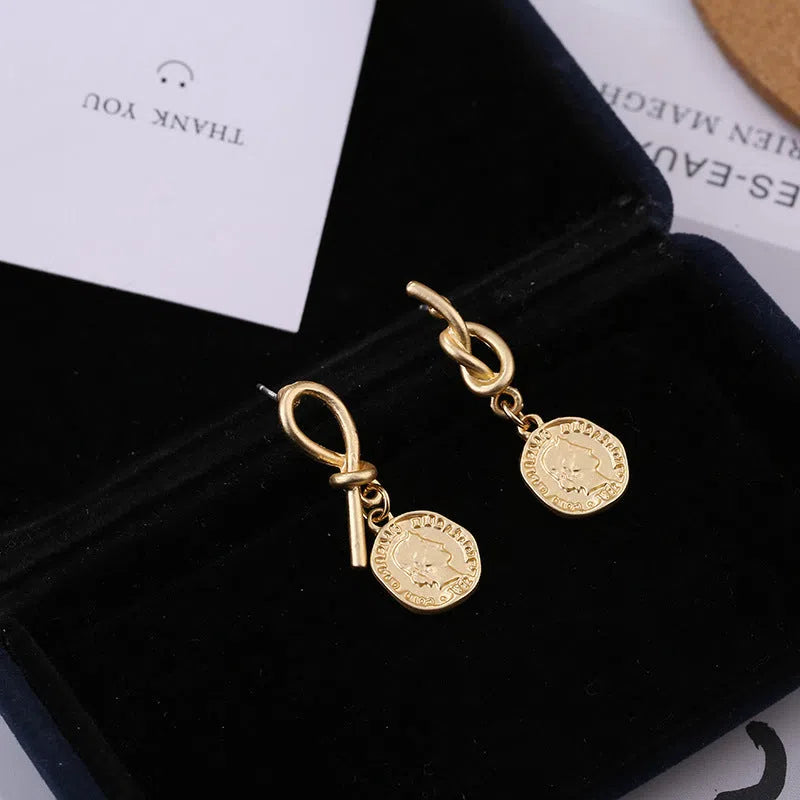 New vintage matte irregular earrings for women in gold alloy colour on display