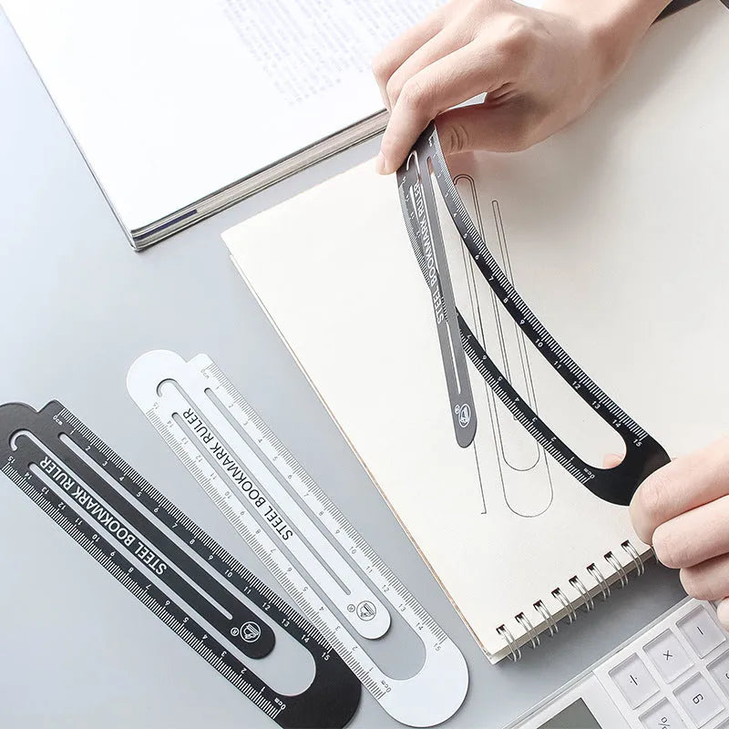 Black and white two-sided metal ruler showing 12cm measurement scales.