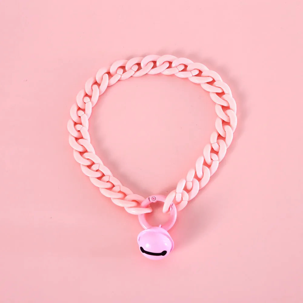 Plastic pet collar in macaron candy colours showing S and M sizes for cats, dogs, and rabbits