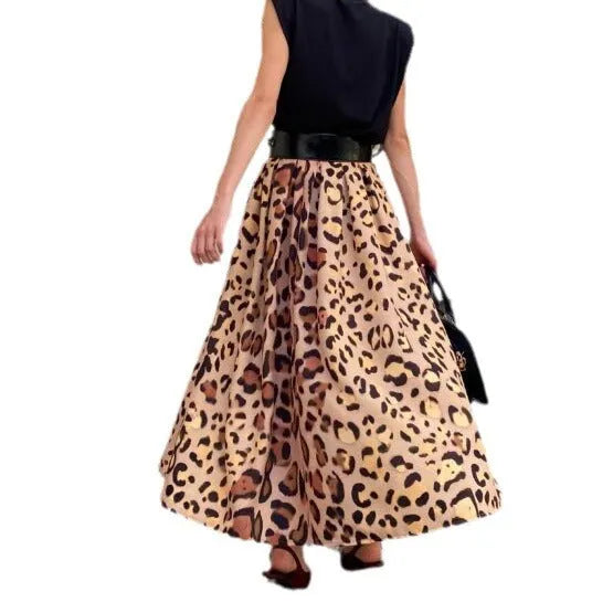 Brown leopard print women's long A-line skirt with a big hem detail on a hanger.