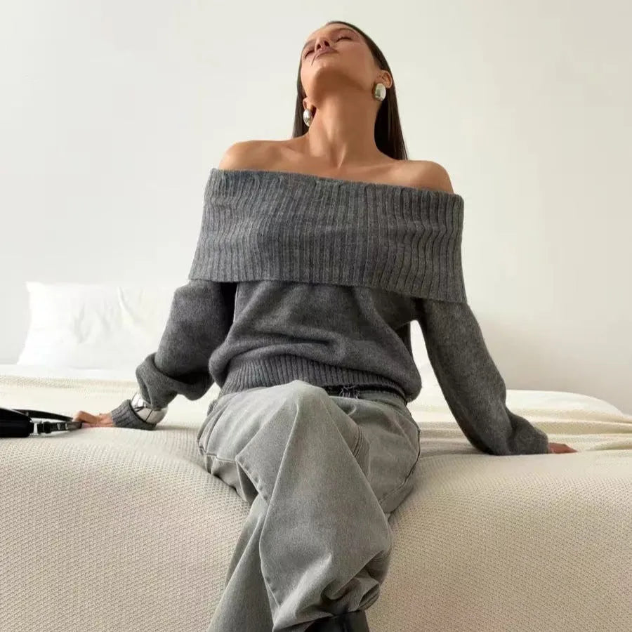 Grey off-the-shoulder strapless sweater with a 3D textured pattern, shown on a model.