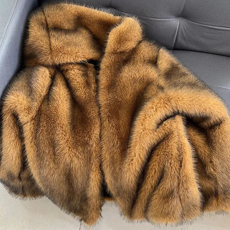 A woman wearing a silver grey loose-fit mid-length artificial fur coat.