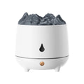 Black and white volcano-shaped ultrasonic humidifier with USB cable on a wooden surface.